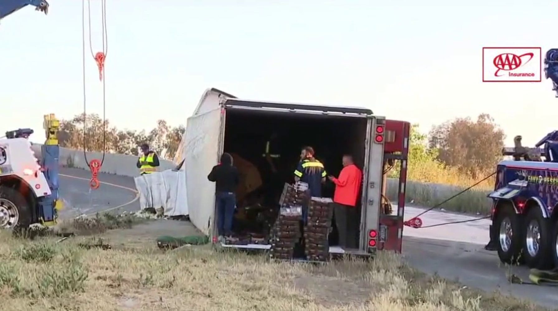 Strawberry-Slicked Highway Creates Traffic Jam After Truck Overturns