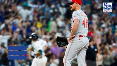Reds pitcher gets irate at umpire for getting in defender's way