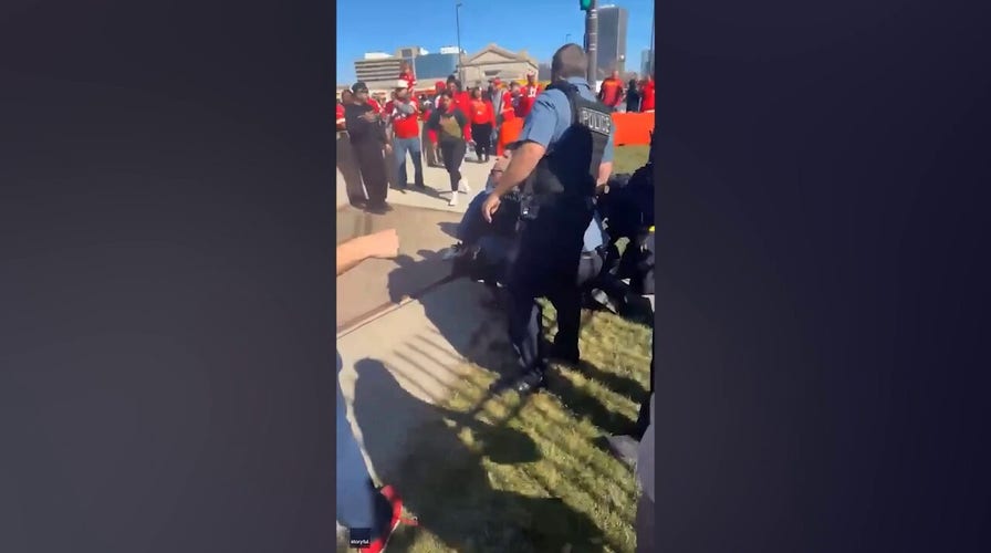 Bystanders at the Kansas City Chiefs Super Bowl parade tackle man they suspect is a shooter
