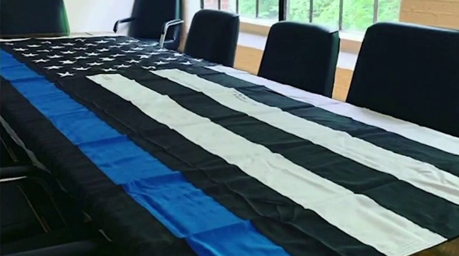 Media company doubles down on pro-police flag