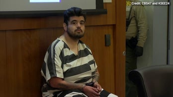 Suspected Walgreens shooter smiles in first court appearance