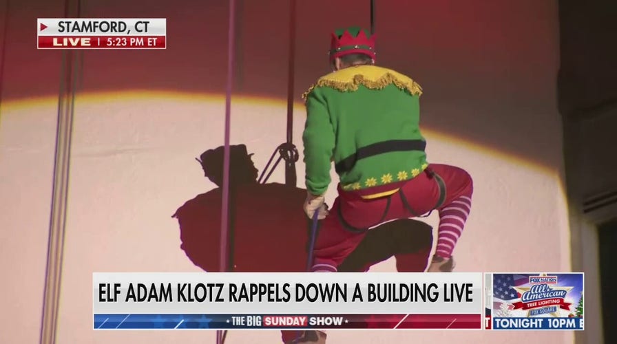 Adam Klotz rappels down a 22-story building