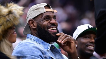 LeBron James sits courtside at Cavaliers playoff game