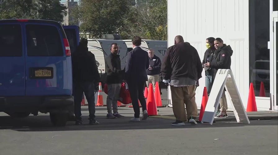 First migrants arrive at NYC tent shelter