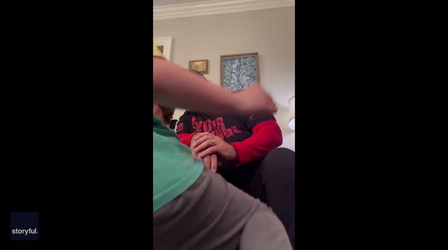 Daughter surprises father with cherished Dan Marino card