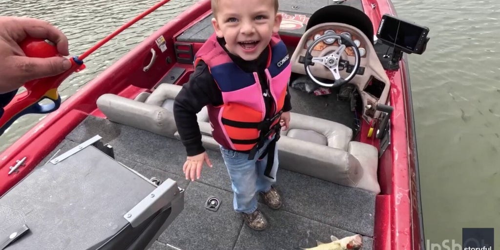 Little boy impresses dad by catching his first fish