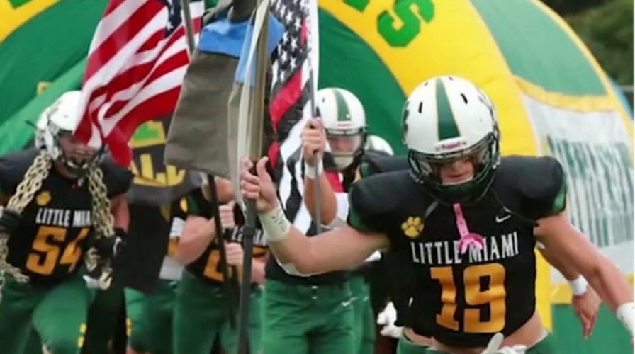 Sons of cop, firefighter carry flags onto field at 9/11 game to honor first responders