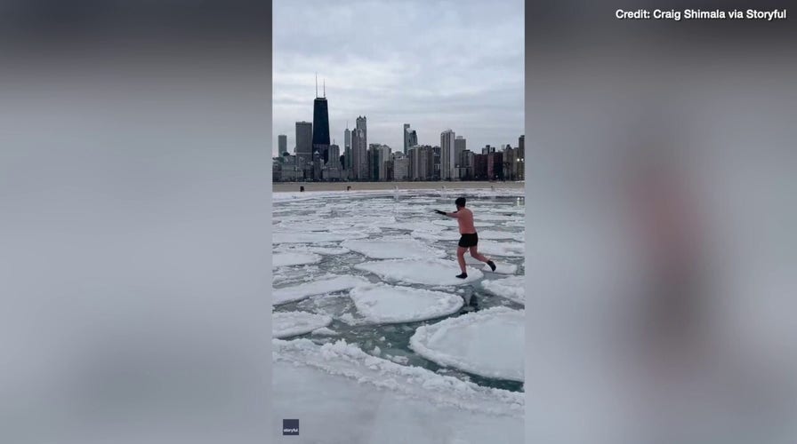 Watch as a man takes a walk along floating ice pancakes
