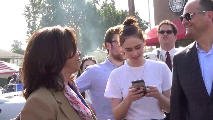 Then-Sen. Harris chants down, down with deportation at 2018 parade