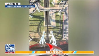 Rider recalls dangling on Texas roller coaster that stalled mid-air