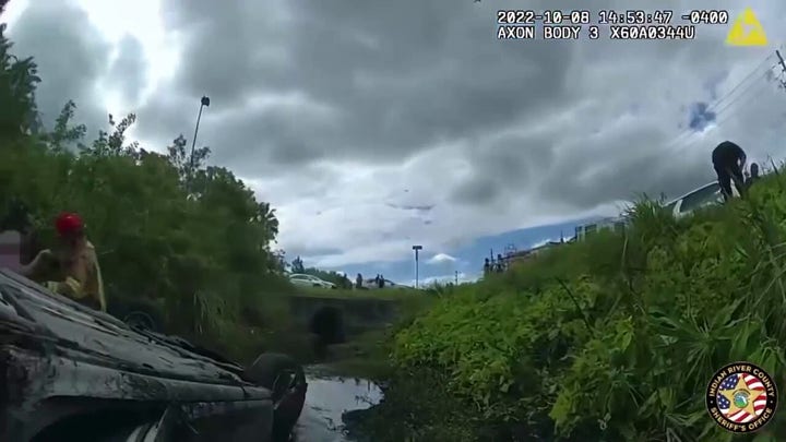 Sheriff's deputies rescue three people trapped in partially submerged car