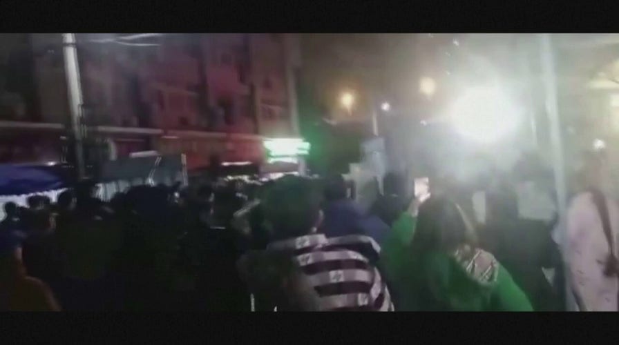 Protesters In Wuhan China Seen Pushing Through Barrier As Us Senators Protesters In Wuhan China Seen Pushing Through Barrier As Us Senators