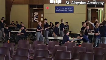 Students at St. Aloysius Academy in Pennsylvania cheer after Pope XIV appointment