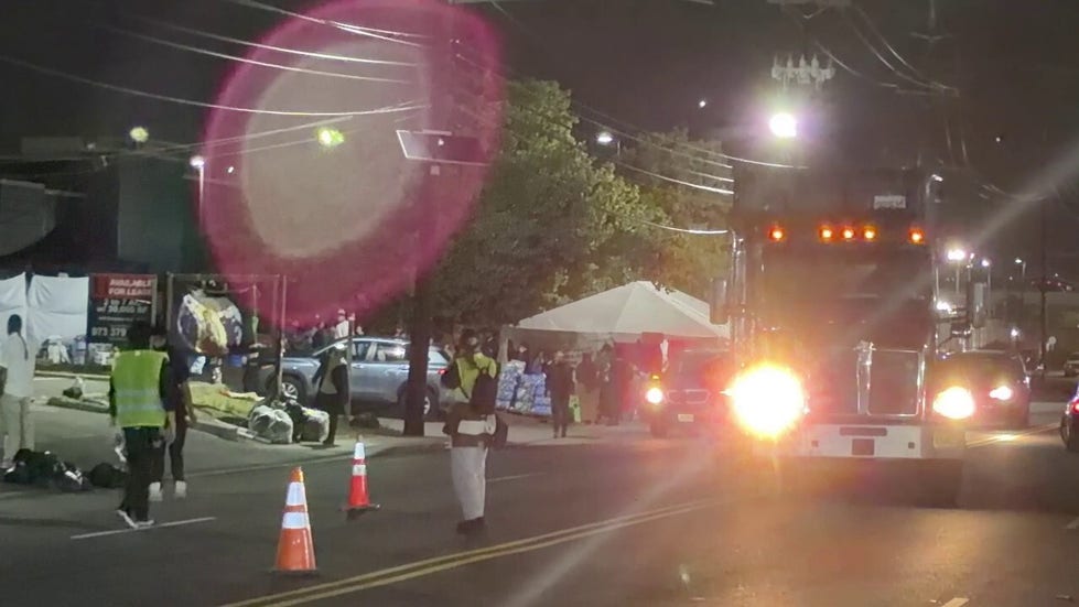 Anti-ICE agitators seen directing traffic outside Delaney Hall detention center