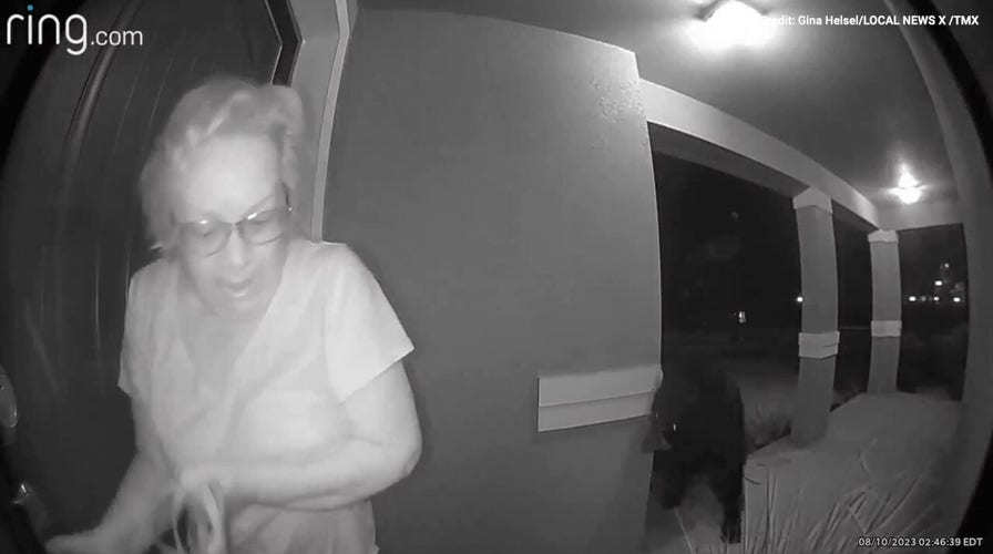 Watch as a woman is startled by a bear outside her Florida home