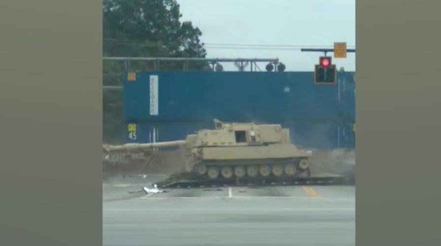 WATCH: Train smashes into mobile artillery vehicle