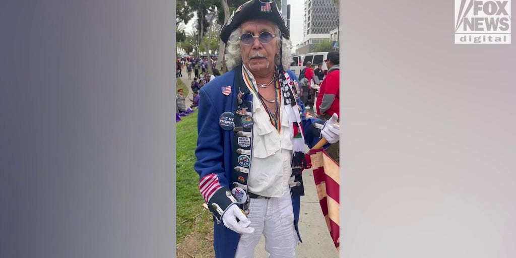 Man in revolutionary costume cites immigration concerns at LA May Day rally
