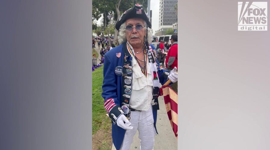 Man in revolutionary costume cites immigration concerns at LA May Day rally