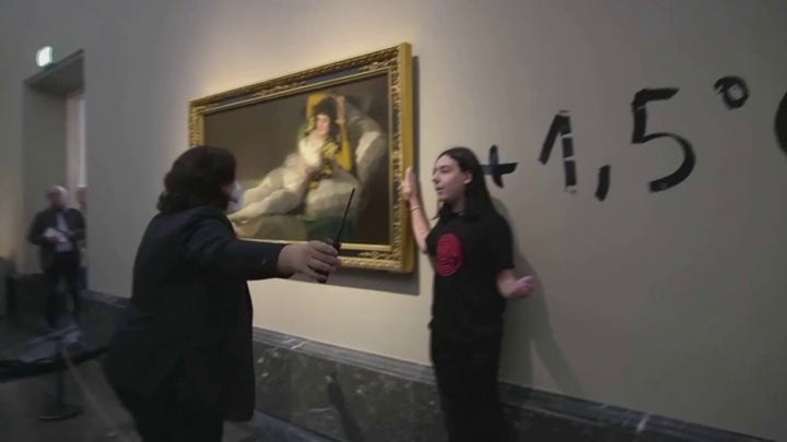 Climate protesters in Spain glue themselves to Goya paintings