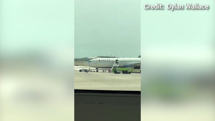 Delta flight evacuated before takeoff after flames shoot out engine
