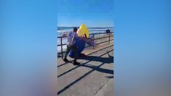Trump supporter attacked in inflatable costume at 'No Kings' rally