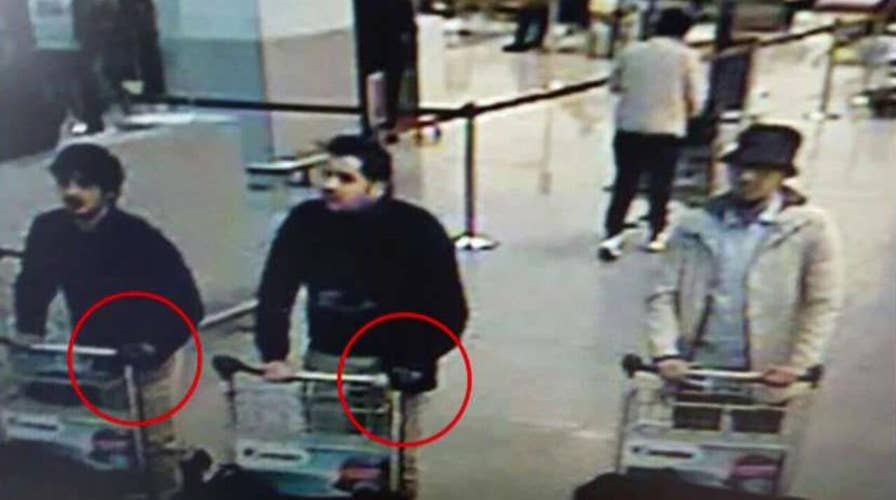 What can be learned from the image of three terror suspects?