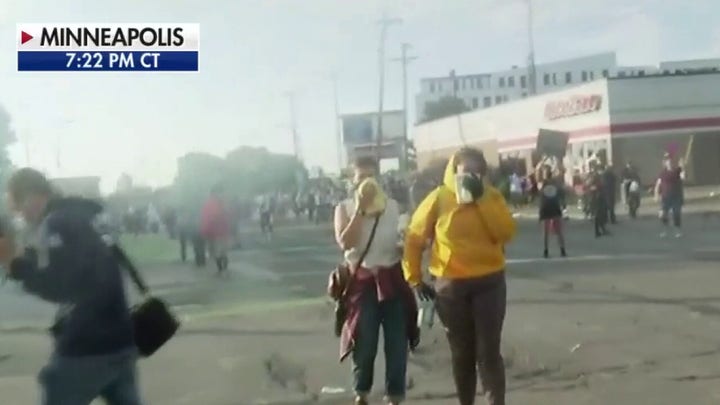 Protesters in tense standoff with police following riots in Minneapolis over man's death in police custody