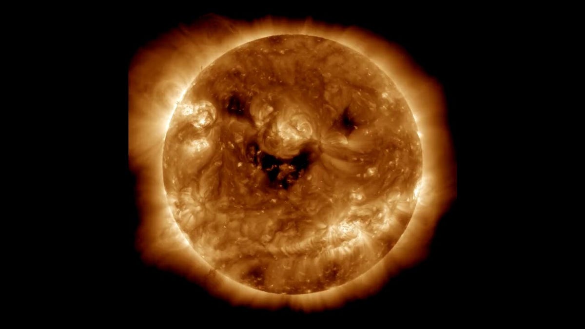 NASA takes image of 'smiling' sun – but it's no laughing matter