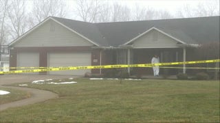 Investigators process the scene where Ashley Flynn was shot and killed