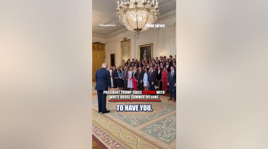 President Trump takes picture with White House summer interns