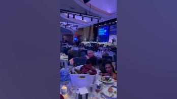 Journalists take cover after shots fired at White House Correspondents’ Dinner