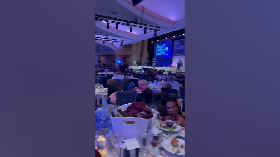 Journalists take cover after shots fired at White House Correspondents’ Dinner