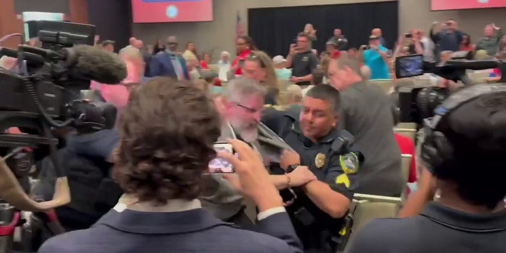 Protester forcibly escorted out of Republican town hall hosted by Marjorie Taylor Greene | Fox News Video