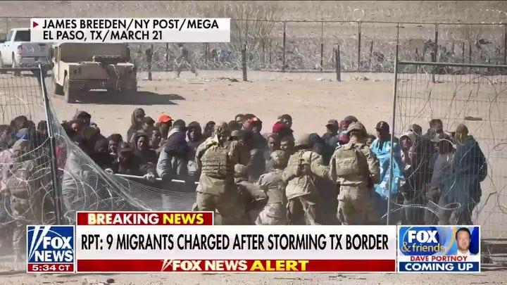 9 migrants charged with assault, inciting riot after storming border