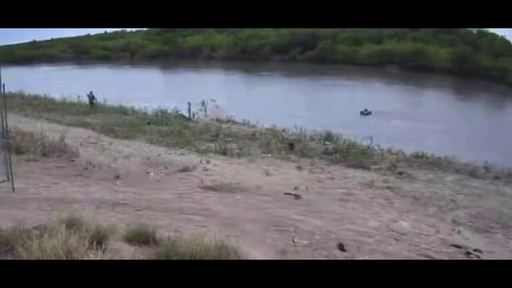 Abandoned migrant child drifts down Rio Grande on flotation device video.mp4