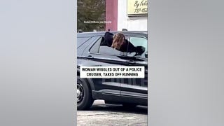 WATCH: Woman WIGGLES out of a police cruiser, TAKES OFF RUNNING