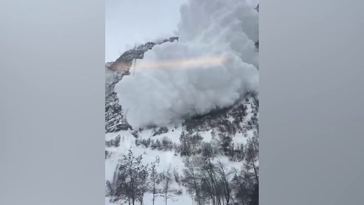 Avalanche slams into moving train in Swiss Alps