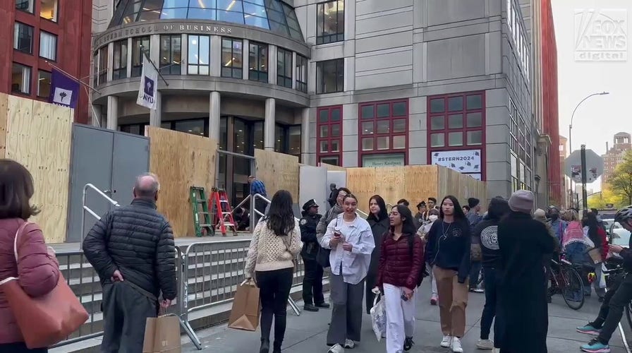 Plywood wall installed outside NYU’s Stern School of Business amid anti-Israel protests