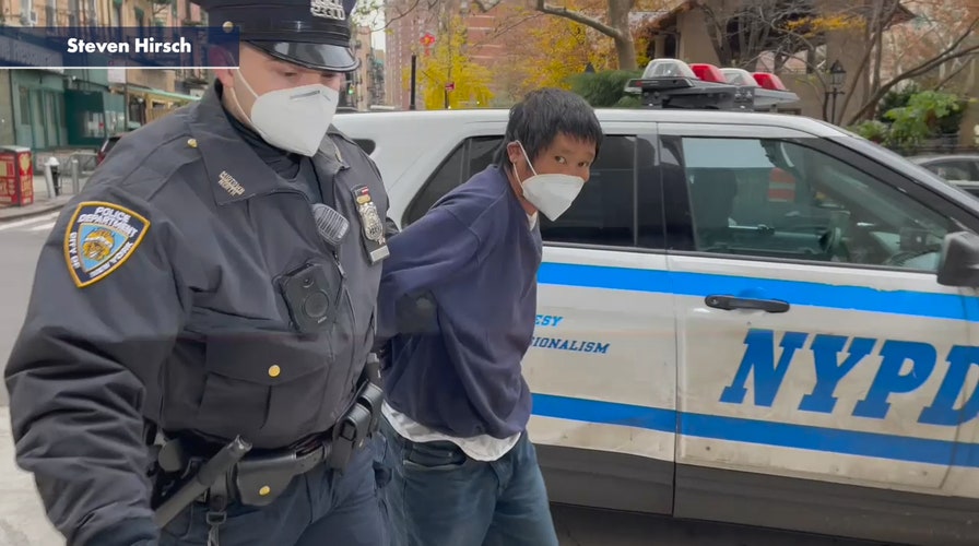 Fox Christmas tree arsonist Craig Tamanaha being walked into central booking before his Manhattan Criminal Court arraignment