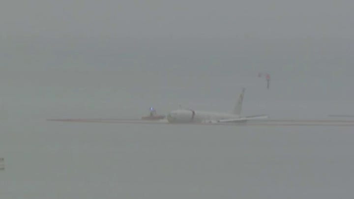 Military aircraft ends up floating in Kaneohe Bay after missing the runway