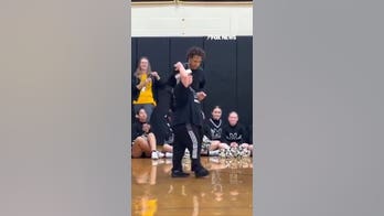 Homecoming king gives crown to classmate with Down syndrome