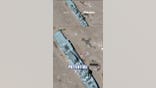 Satellite images show China's mock US warship