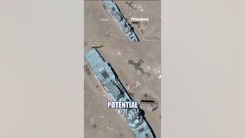 Satellite images show China's mock US warship
