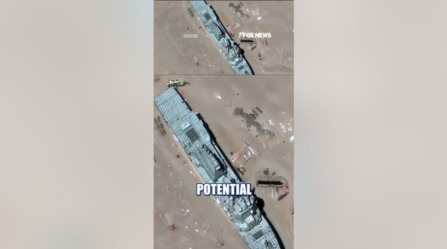 Satellite images show China's mock US warship