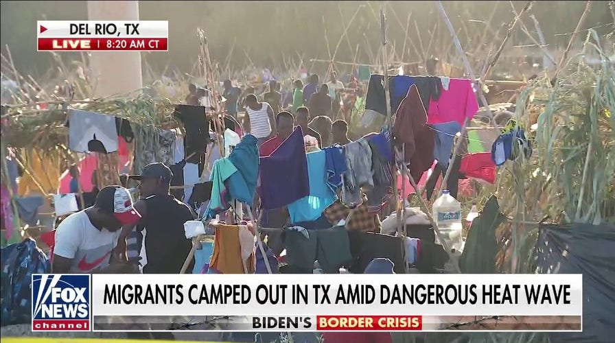 Thousands of migrants remain camped under Texas bridge amid heat wave