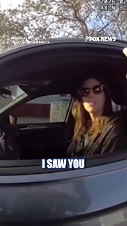 One-handed woman stopped for alleged cellphone use while driving