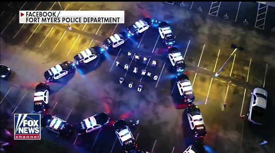 Florida police park cruisers in shape of heart outside hospital