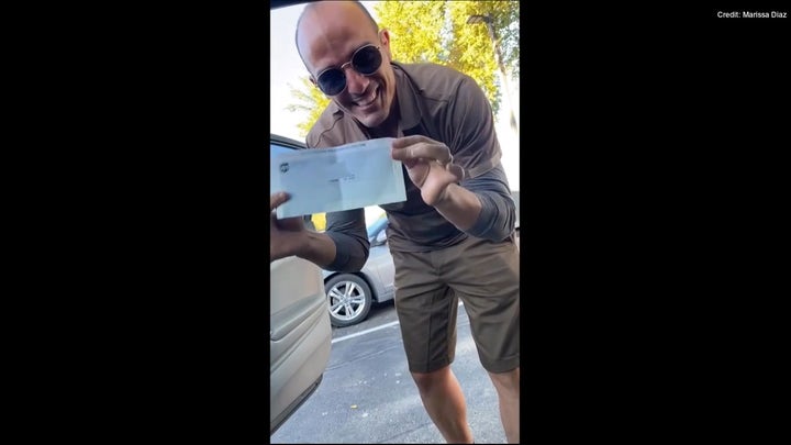 Arizona UPS worker celebrates 1st paycheck received in America
