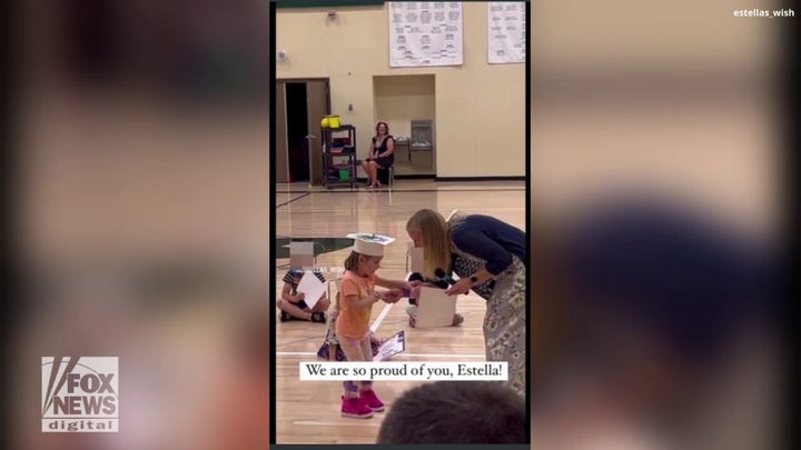 Preschooler accepts diploma while facing partial paralysis