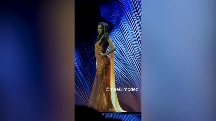Miss Universe Jamaica contestant falls off stage during evening gown round